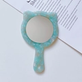 Close-up of cat-shaped handheld mirror with light blue marble pattern and round handle - 12cm*7.5cm / Cyan