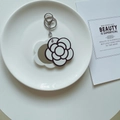 Black and white flower acrylic keychain with hidden portable makeup mirror - White Base Camellia Mirror