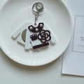 White acrylic sweater-shaped mirror keychain with black camellia and pearls - White Sweater Shape Mirror