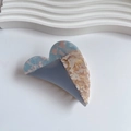 Detail view of heart-shaped acetate hair claw with tricolor patchwork textures - 8.5cm*5.3cm / Blue