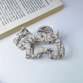 Chic marbled cream acetate hair claw clip featuring a unique hollow elephant design - Large Beige Elephant