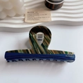 Franse stijl haarklem van donkerblauw en gemarmerd acetaat met gouden logo - Kruis Haarklem
