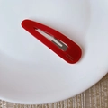 Detail showing bright red acetate drop-shaped hair clip with gold France handmade logo - Teardrop BB Clip Style