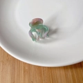 Macro detail of acetate octopus hair claw featuring France Handmade gold logo lettering - 7# Green Pink - 3.2cm*3cm
