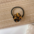 Elegant tortoise shell camellia acetate hair tie with golden handmade lettering detail - Leopard Print