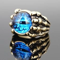 Gothic punk devil eye ring with blue dragon eye stone and antique gold claw band - Gold Tone Blue Eye