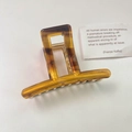 Minimalist tortoiseshell acetate hair claw clip with golden spring in amber brown finish - Amber Tortoiseshell / Caramel