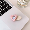 Pink heart-shaped acetate hair clip with sparkling rhinestone on a laptop surface - Pink Heart Beige Clip