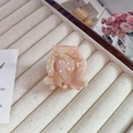 Pink marble acetate hair claw with white polka dots and gold accents in jewelry box - Pink Small