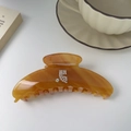 Detail showing amber resin hair claw clip with rhinestones and elegant prop background - Caramel Color (5007155584056) / 3# Caramel