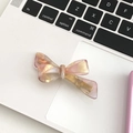 Pink marbled acetate bow hair clip on a white keyboard background, feminine style - Metallic Purple