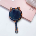 Cat-shaped handheld mirror in tortoiseshell resin with gold heart details and paw accent - Leopard Print