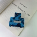 Elegant square acetate claw clip in blue and black ink marble pattern on a book - Blue Ink Marble (Small)