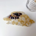 Elegant conch-shaped acetate hair claw clip with beige marble texture and gold detailing - Brown
