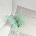 Elegant mint green butterfly hair claw clip with marble texture and gold spring - Cyan