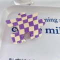 Puzzle shaped hair claw clip featuring a purple and cream checkered pattern - Purple
