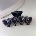 Pink heart hair claw clip with four gray acetate hearts and sleek black base - Black