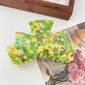 Elegant bow-shaped hair claw clip with green and yellow marbled floral texture - Green
