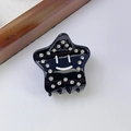 Pinza per capelli a stella nera in acetato con strass e dettaglio con faccina sorridente - Nero