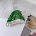 Detailed close-up of green marble acetate hair claw in festive Christmas hat design - Green Hair Claw / Green Christmas Hat Design