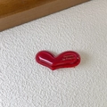 Close-up of red heart acetate hair clip with gold Barrette La France text engraving - 4cm / Red