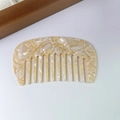Detail view of acetate wide tooth hair comb with elegant cream marble texture and anti-static design - 7# Beige White