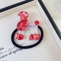 Detail of cute poodle acrylic hair tie with rhinestones on a black elastic band - Red
