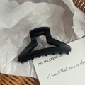 Detail shot of a matte black triangle shark hair claw clip with sleek geometric cutout design - 7# Matte Black