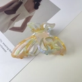 Elegant cutout butterfly claw clip in translucent iridescent gradient acetate finish - Dazzling Orange