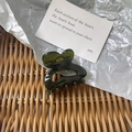 Detail of dark green translucent resin hair claw clip with heart-shaped silhouette - Green