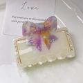 Elegant cream acetate hair claw clip with purple and yellow marbled rhinestone bow - Mermaid White