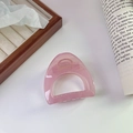 Pink translucent matte hair claw clip in a minimalist geometric hollow design for women - Pink
