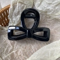 Elegant glossy black acrylic bow claw clip with high-shine finish for women hairstyles - Bright Black