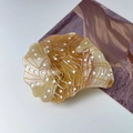 Brown seashell acetate hair claw clip with golden spiral patterns and white dots - Coffee Conch