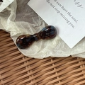 Detailed close-up of tortoise shell pattern acetate bow barrette on a vintage card - Candy Bow Knot / Blue Brown