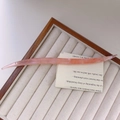Detail of pink acetate hair pin with pearlescent texture on a beige jewelry stand - Phantom Pink