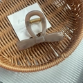 Elegant coffee brown bow-shaped hair claw clip in a woven basket for hair styling - Light Coffee