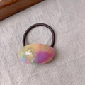 Detail of acetate ponytail holder with colorful marble pattern and elastic hair band - Colorful