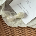 Elegant mini pearl acetate bow hair clip with gold logo lettering in cream white - Candy Bow Knot / Mermaid White