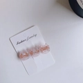 Three-piece set of pink marble texture acetate cat hair clips on a white display card - Pink