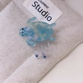 Detail view of turtle hair claw clip made of blue iridescent cellulose acetate - Small / Blue