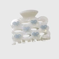 Detail of acetic acid hair claw clip with pearlescent finish and blue bow designs - Pearl White
