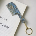 Blue marble acetate mini comb keychain with gold metal ring on a white book - Floral Blue