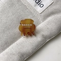 Close-up of a mini amber acetate hair claw clip featuring five white faux pearl details - Approx 2.5cm / Caramel