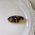 Barrette à cheveux faite main en acétate léopard avec nœud noir et détail doré - Imprimé léopard