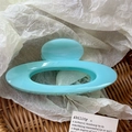 Elegant light blue oval hollow hair claw clip with a glossy resin finish for women - Lake Blue
