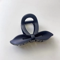 Pince à cheveux élégante noir mat avec nœud et poignée annulaire pratique pour femme - Noir mat