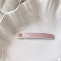 Pink heart rhinestone rectangular hair clip with white lettering on a ceramic plate - 7cm / Pink