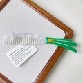 Detail of creative tulip hair comb made of premium marble white acetate with green handle - Scallion Style (S113)