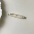 Eleganter beiger ovaler Haarclip mit bunten Strasssteinen und goldenen Details - Creme